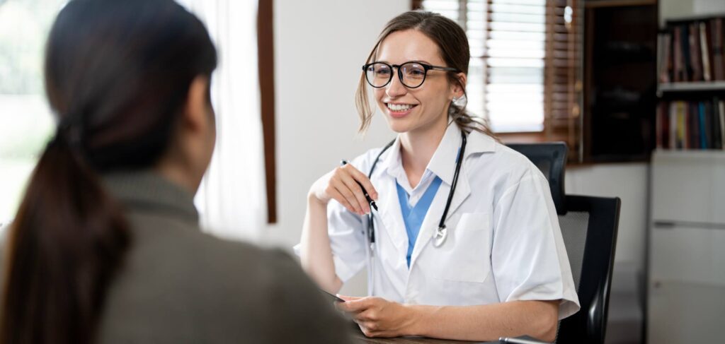Clinician evaluating a new patient at a rehab in Somers Point.