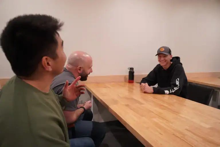 People sharing and discussing in group therapy.