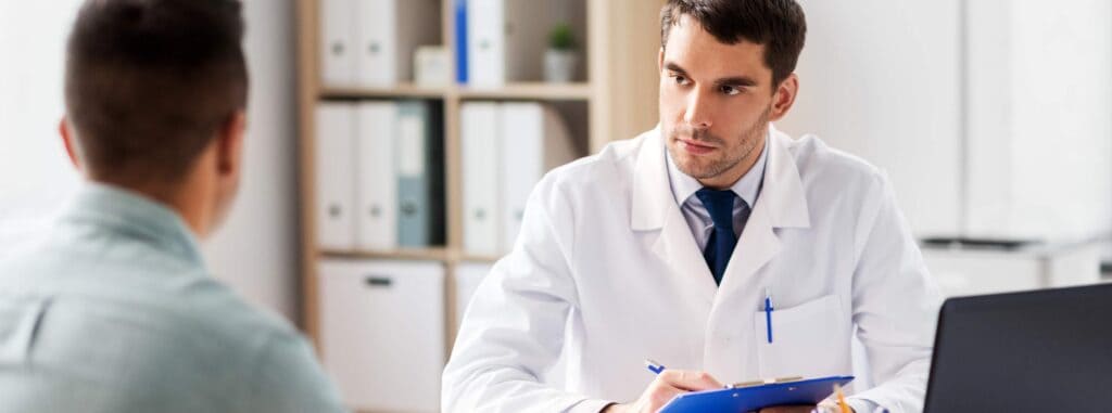 Doctor guiding patient through South Jersey alcohol addiction treatment.