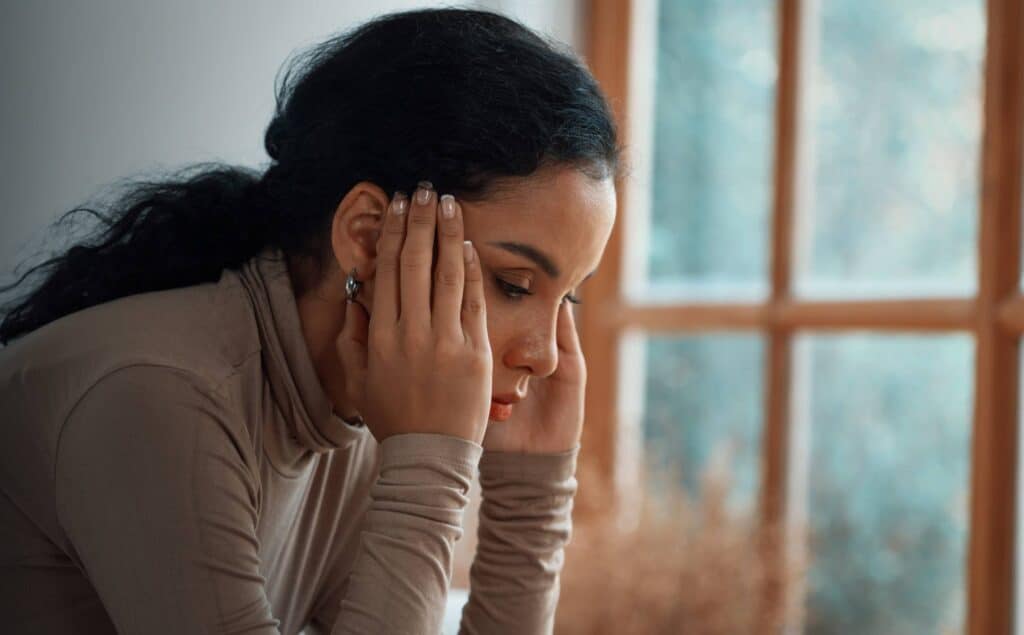 Woman coping with mental health and substance use struggles.