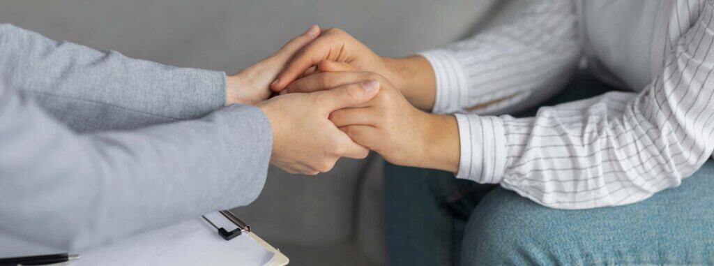 Woman getting emotional support during South Jersey alcohol addiction treatment.