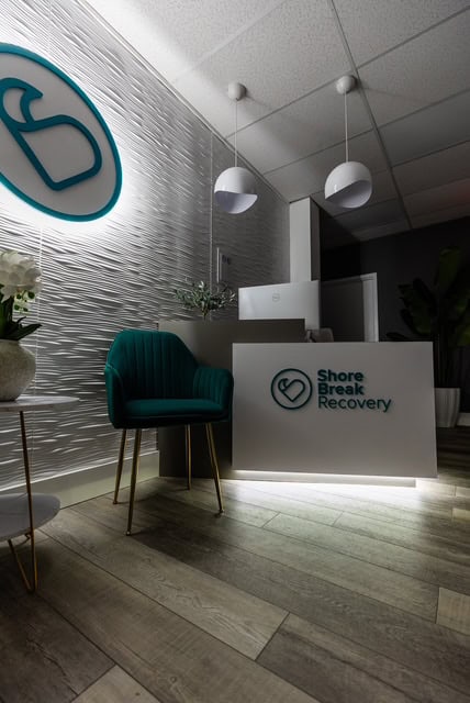 Wall logo and reception area at our South Jersey rehab center.