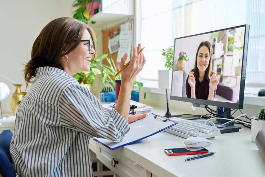 A woman enjoys personalized care through South Jersey virtual IOP treatment.