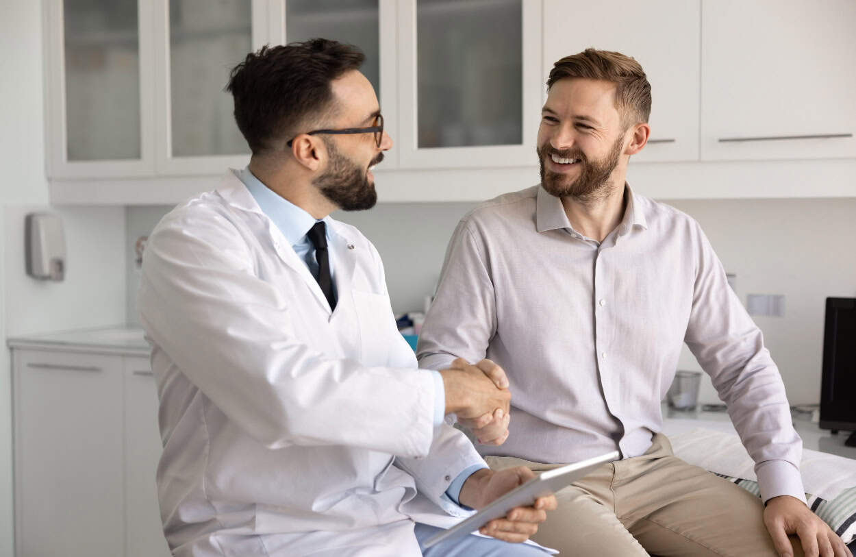 A man consults his doctor during South Jersey hallucinogen addiction treatment.