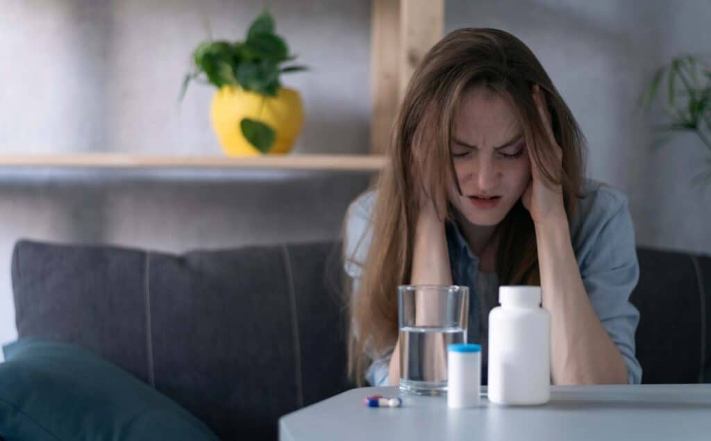 Woman experiencing symptoms of Adderall addiction.