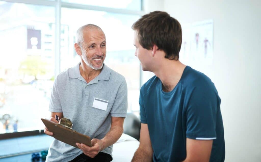 Man talking with a clinician at a South Jersey Adderall addiction treatment program.