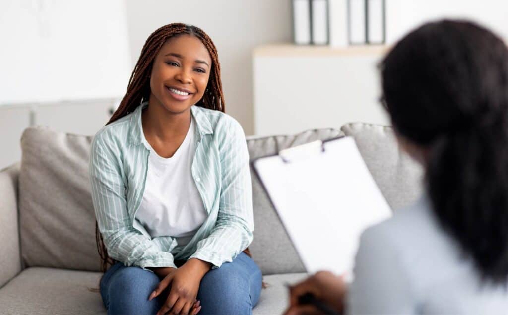 Woman speaking with a therapist at a rehab near Brigantine, NJ.
