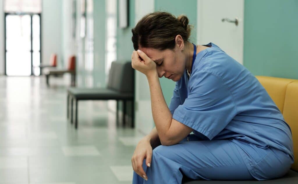 Healthcare professional under stress considering rehab in New Jersey.