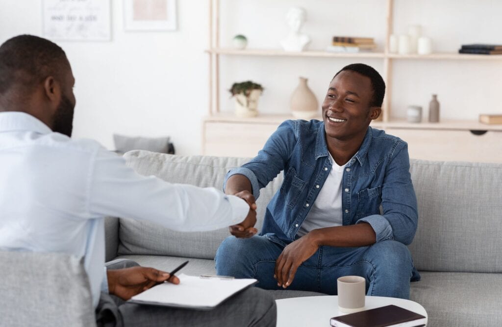 A man talks to his therapist about health coping mechanisms during First responders rehab in New Jersey.