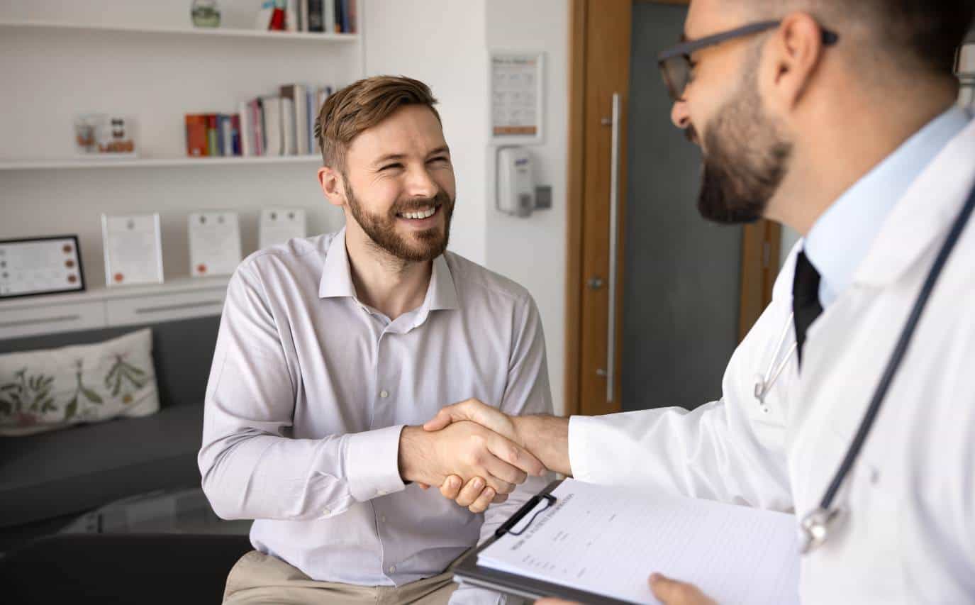 Man meeting with a physician at a UMR rehab in New Jersey.