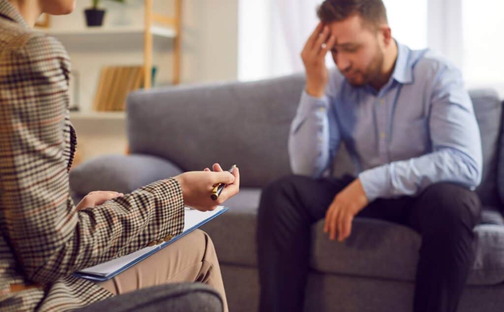 Man in therapy session at South Jersey valium addiction treatment center.
