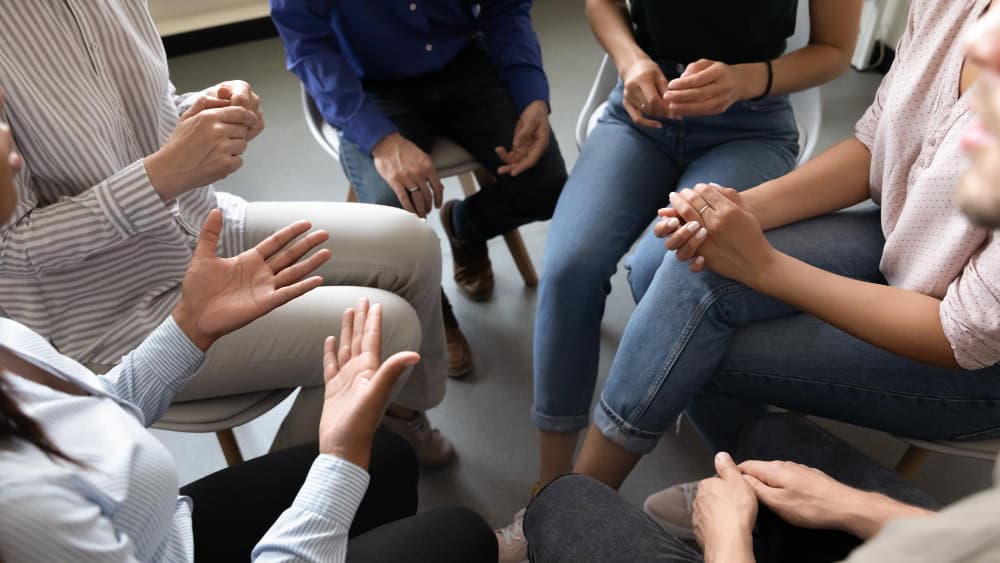 Therapist taking notes during south jersey hydrocodone addiction treatment session with teenager