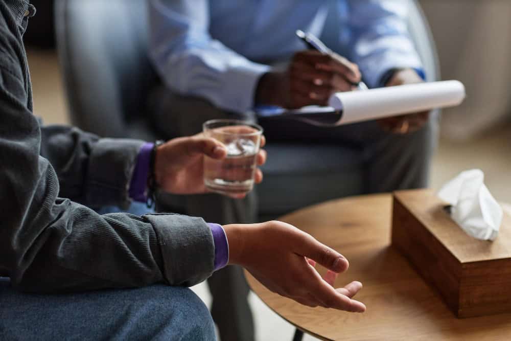 Teen speaking with therapist during rehab near Ocean County NJ counseling session