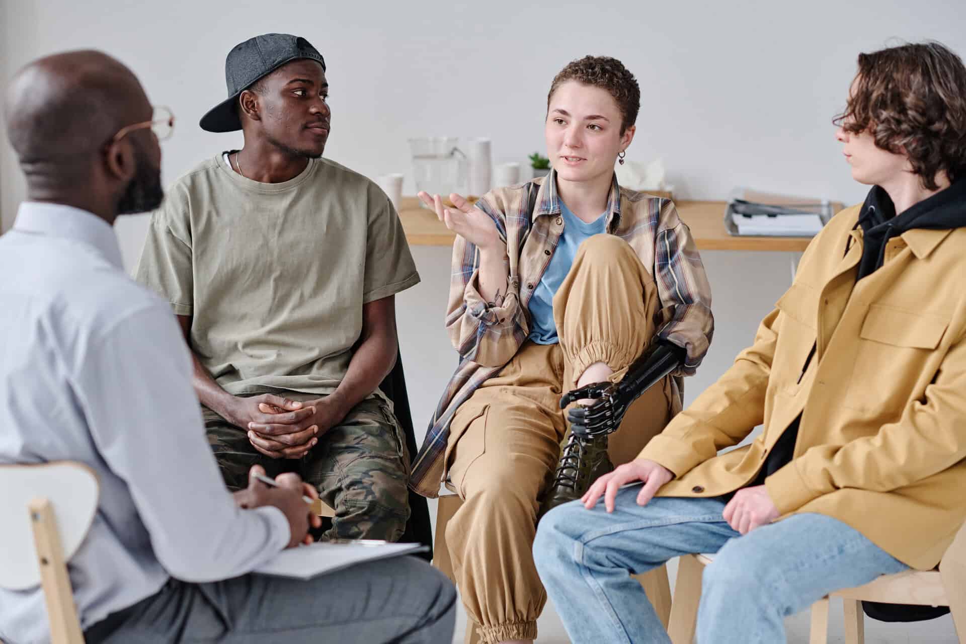Young woman participating in group therapy for LSD addiction treatment in NJ