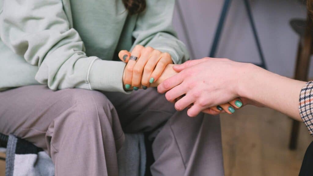 Close-up of a woman's hand during a supportive therapy session at a drug rehab near Atlantic City, NJ.