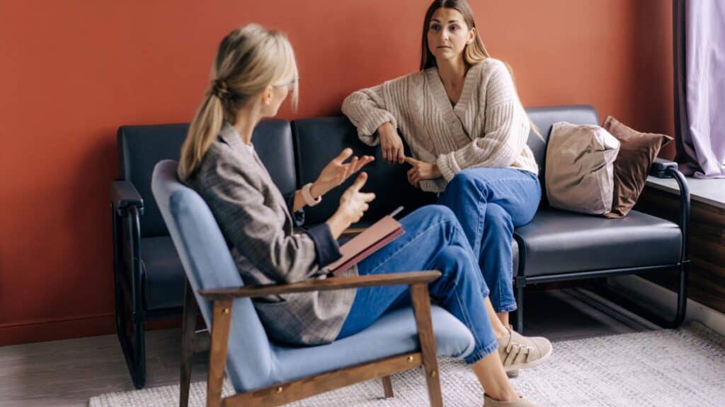 A woman receiving guidance from a clinical counselor at an addiction recovery center and drug rehab near Atlantic City, NJ.