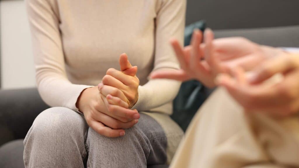 A female counselor providing supportive mental health guidance to a patient at a drug rehab near Galloway Township, NJ