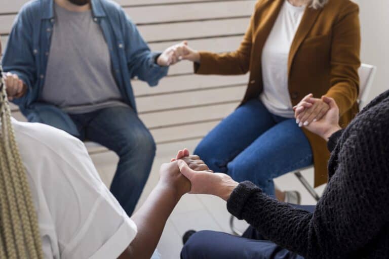 People enjoy a group treatment exercise during recovery treatment.